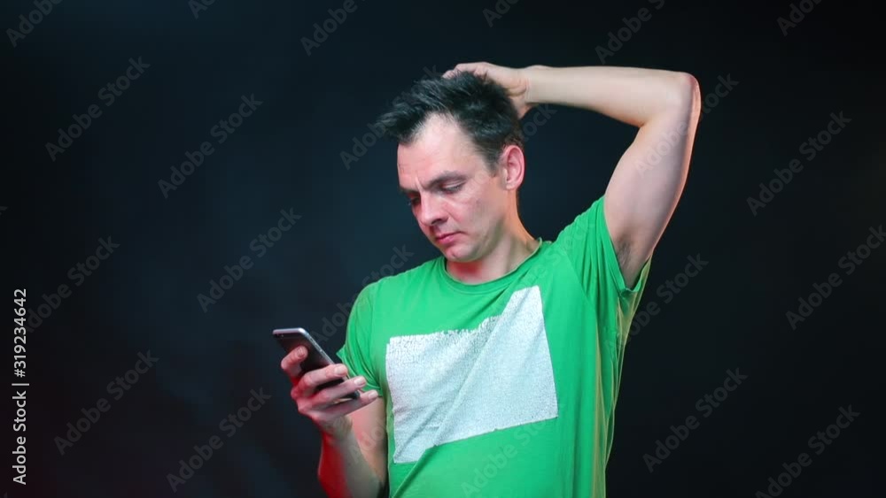 Portrait of a man typing text message on smartphone. Portrait of a man typing text message on smartphone.