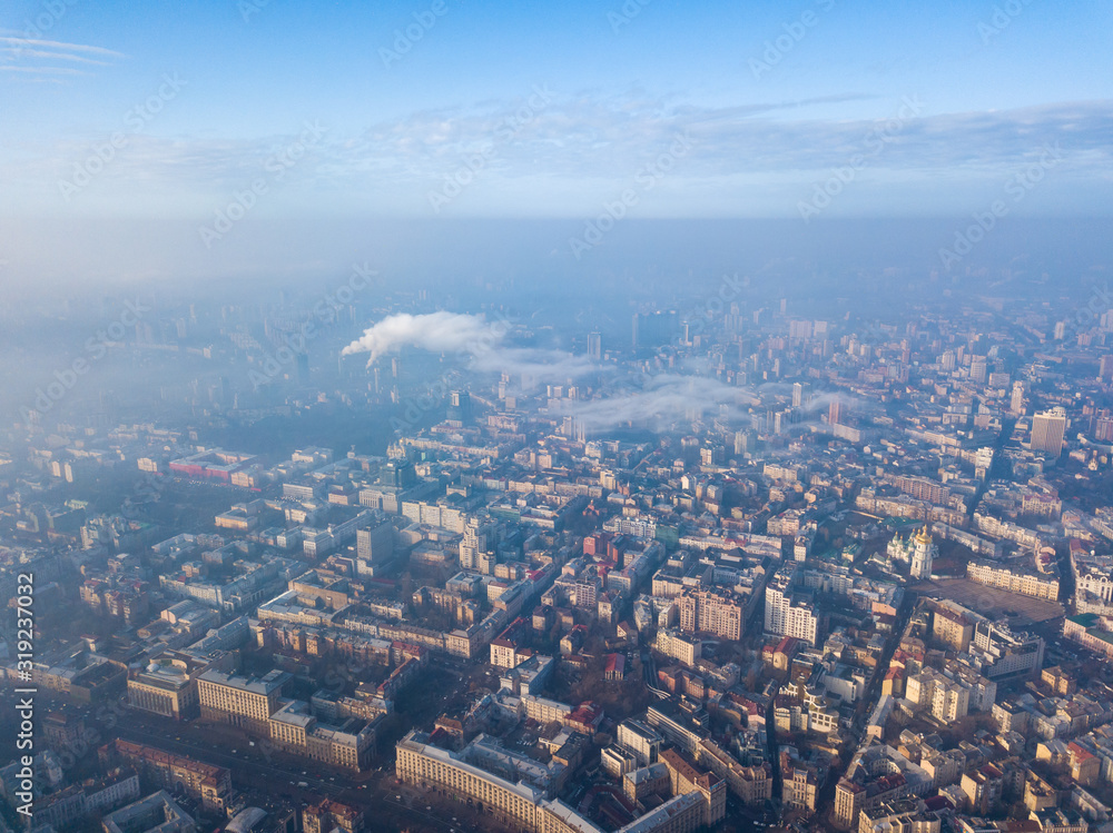 Fototapeta premium Aerial drone view. Houses in the city center of Kiev on a foggy morning.