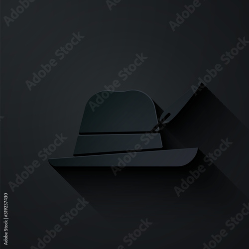 Paper cut Oktoberfest hat icon isolated on black background. Hunter hat with feather. German hat. Paper art style. Vector Illustration