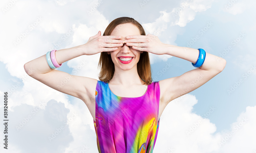 Redhead beautiful woman with hands covering eyes Redhead beautiful woman with hands covering eyes