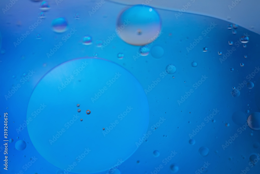 Oil drops in water. Defocused abstract psychedelic pattern image blue colored. DOF. Oil drops in water. Defocused abstract psychedelic pattern image blue colored. DOF.