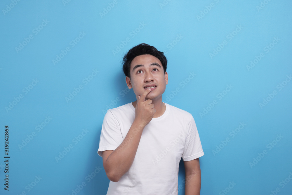 Asian man thinking something, looking for good idea