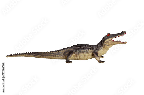 Toy figure of crocodile made of plastic. Children's games or collecting. Isolated © Zakharenkova