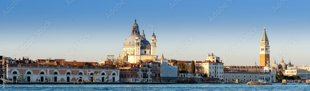 Long horizontal BANNER. Cityscape of Venice at sunset. City buildings on the water.