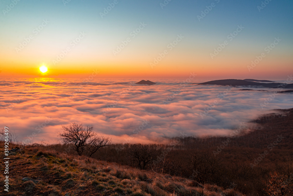 beyond the foggy sky on mountain in sunset nature