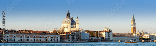 Long horizontal BANNER. Cityscape of Venice at sunset. City buildings on the water.
