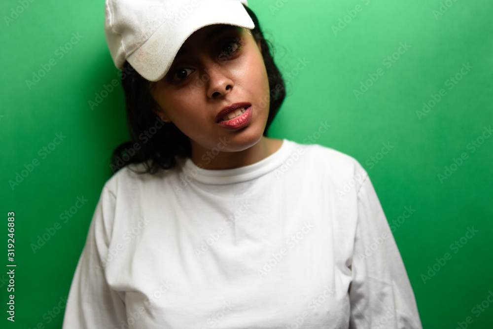 Young egyptian woman wearing white shirt with happy face expression. Young egyptian woman wearing white shirt with happy face expression.