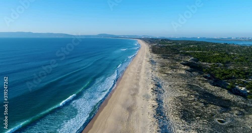 Aerial view of the Comporta Beach and the Troia Peninsula with the Arrabida Mountain on the background, in Portugal