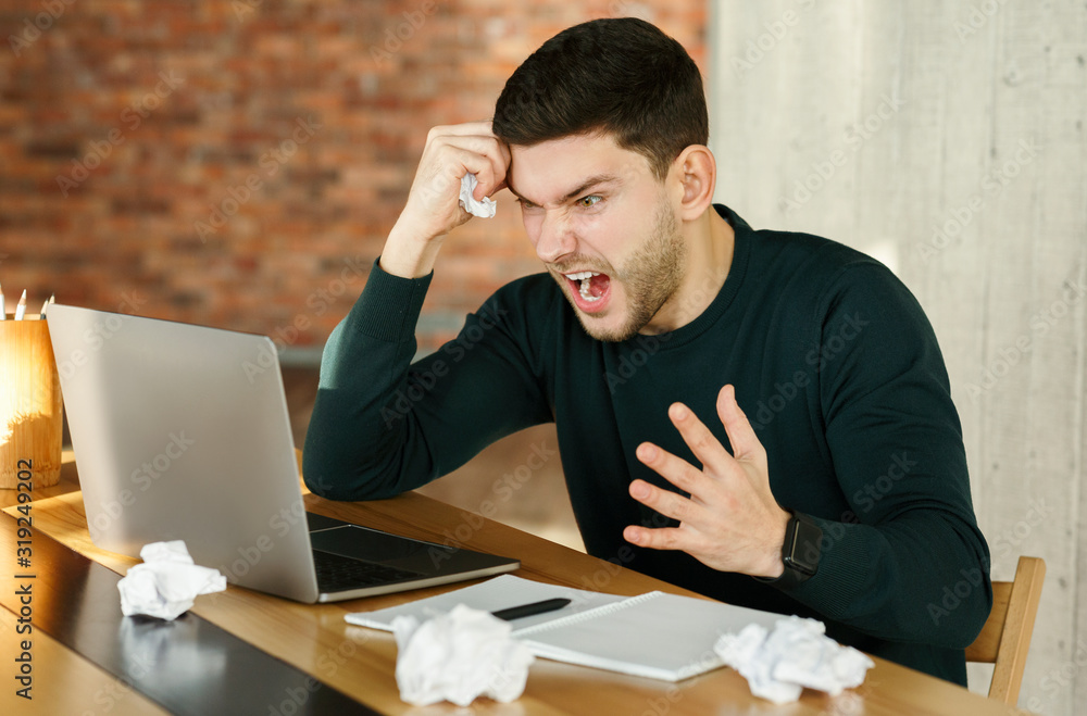 Angry Businessman Shouting Crumpling Paper Sitting In Modern Office Angry Businessman Shouting Crumpling Paper Sitting In Modern Office