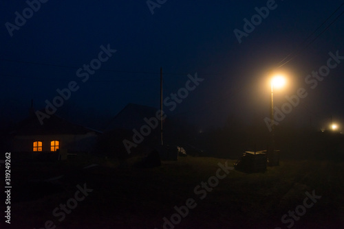 Fototapeta Naklejka Na Ścianę i Meble -  one house light in small village on countryside