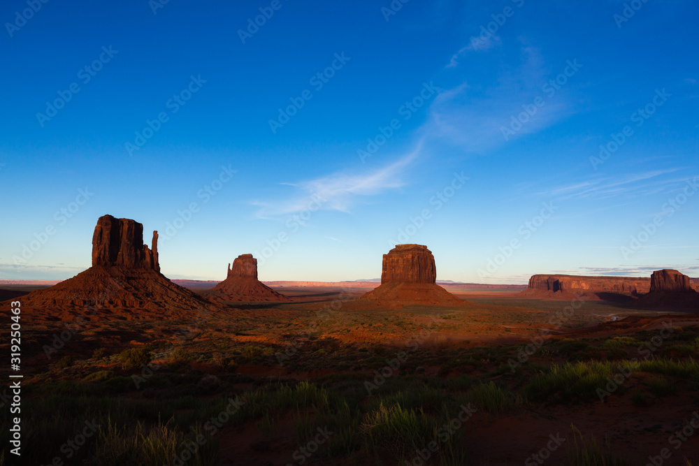 Sunset on the beautiful formations of Monument Valley in the American West.
