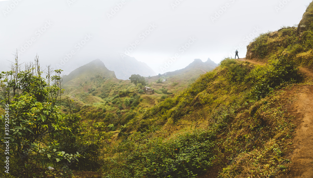 Santo Antao Island, Cape Verde. Traveler tourist hiking on mountain plateau of Paul Valley