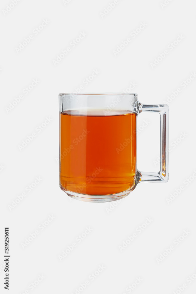 Glass mug with tea on a white background. Isolate. Glass mug with tea on a white background. Isolate.