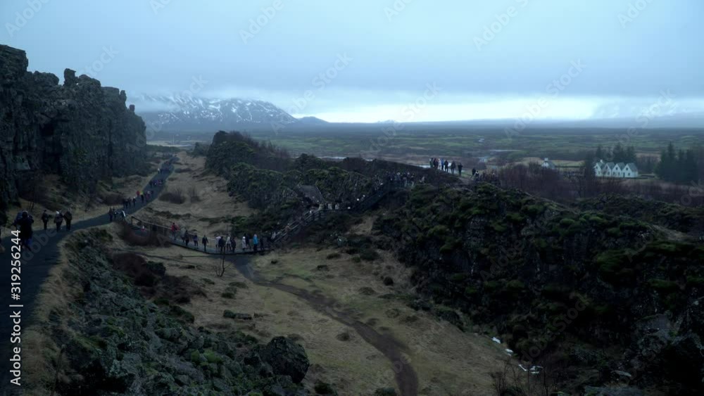 4K: Thingvellir National Park in Iceland. Tectonic Plates natural Landscape. Tourists. Wide Shot 4K: Thingvellir National Park in Iceland. Tectonic Plates natural Landscape. Tourists. Wide Shot