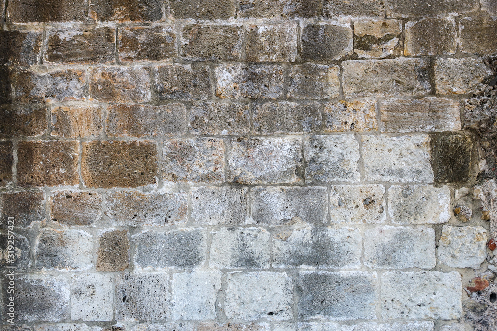 Fototapeta premium A dirty smudged old White bricks.