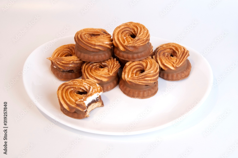 Cakes on a white plate on a white background Cakes on a white plate on a white background