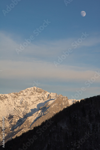 Snowy mountain at sunset