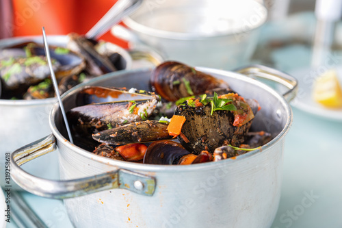 Mussels in spicy sauce, served in a pan, Athens, Greece