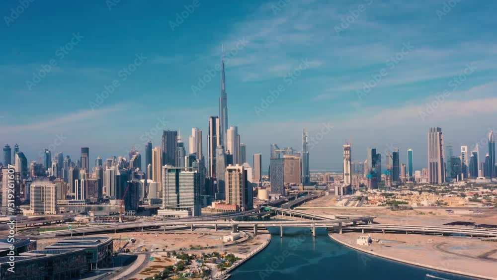 AERIAL. Drone video of Dubai city at day time. Modern city concept vith transport and river.