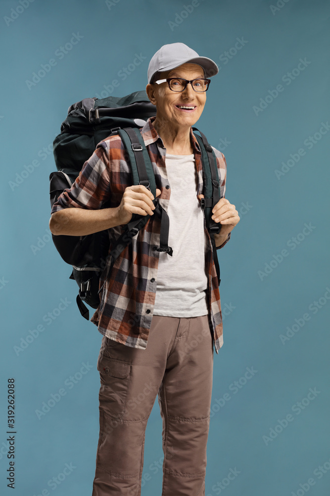 Elderly male hiker with a backpack Elderly male hiker with a backpack