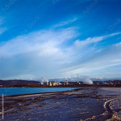 View of an industrial chemical complex in on the coast of the Mediterranean sea in Tuscany, shot with analogue film technique