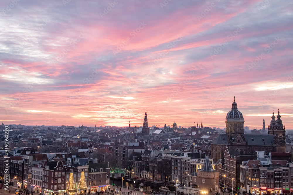 Pink winter sunset overlooking the Amsterdam Netherlands skyline