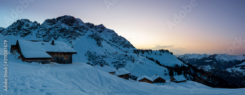 Evening mood in a lonely mountain hut in the Austrian Alps, summit of the Breithorn in the background, Grosses Walsertal