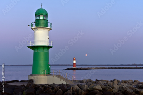 Rising Moon Behind Lighthouse at Warnemünde, Baltic Sea, Mecklenburg Western Pomerania, Germany, Europe photo