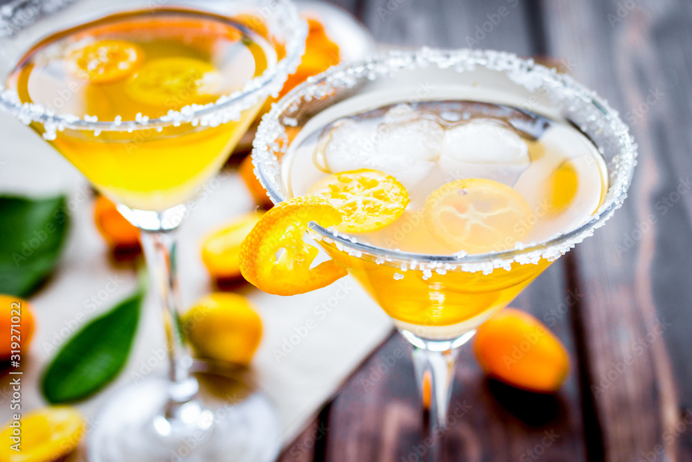 cocktail with kumquat on wooden background cocktail with kumquat on wooden background