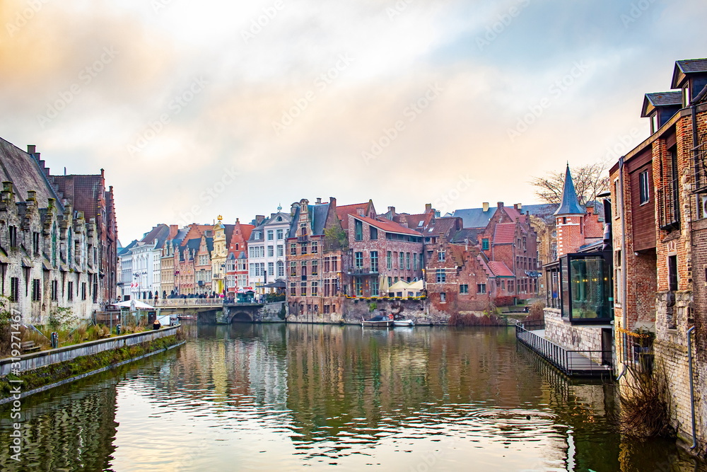A canal view and colorful architecture in Ghent Belgium on a cloudy winter December day