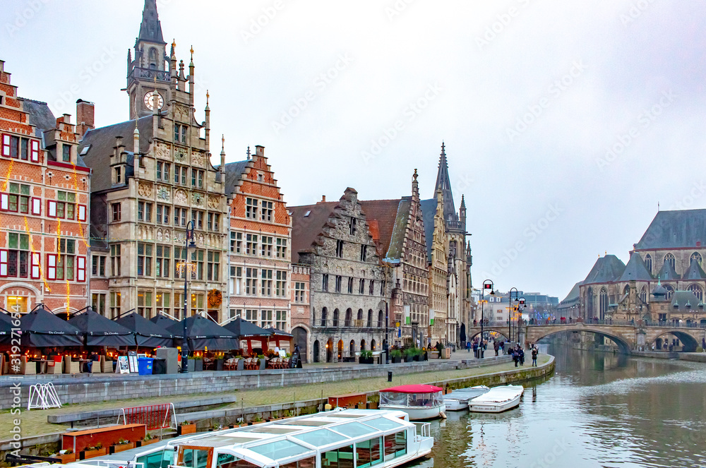 A canal view and colorful architecture in Ghent Belgium on a cloudy winter December day	