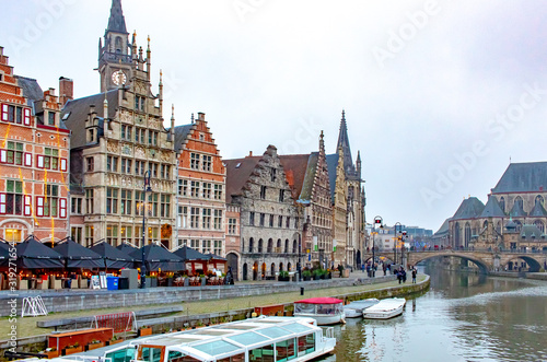 A canal view and colorful architecture in Ghent Belgium on a cloudy winter December day 