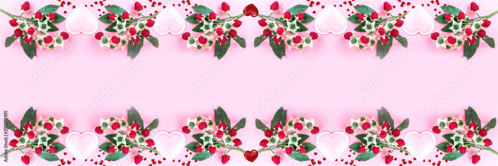 Berries and hearts on a pink background. Large-format banner for Valentine's Day. Concept of love. Happy Valentine's Day. Top view, mirror layout Berries and hearts on a pink background. Large-format banner for Valentine's Day. Concept of love. Happy Valentine's Day. Top view, mirror layout