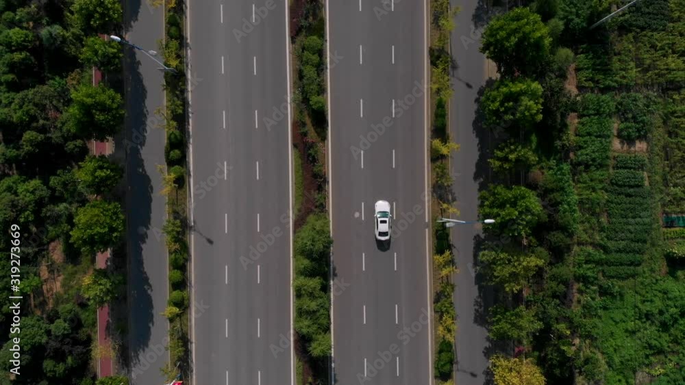 Aerial top view of a road with small traffic in small chinese city