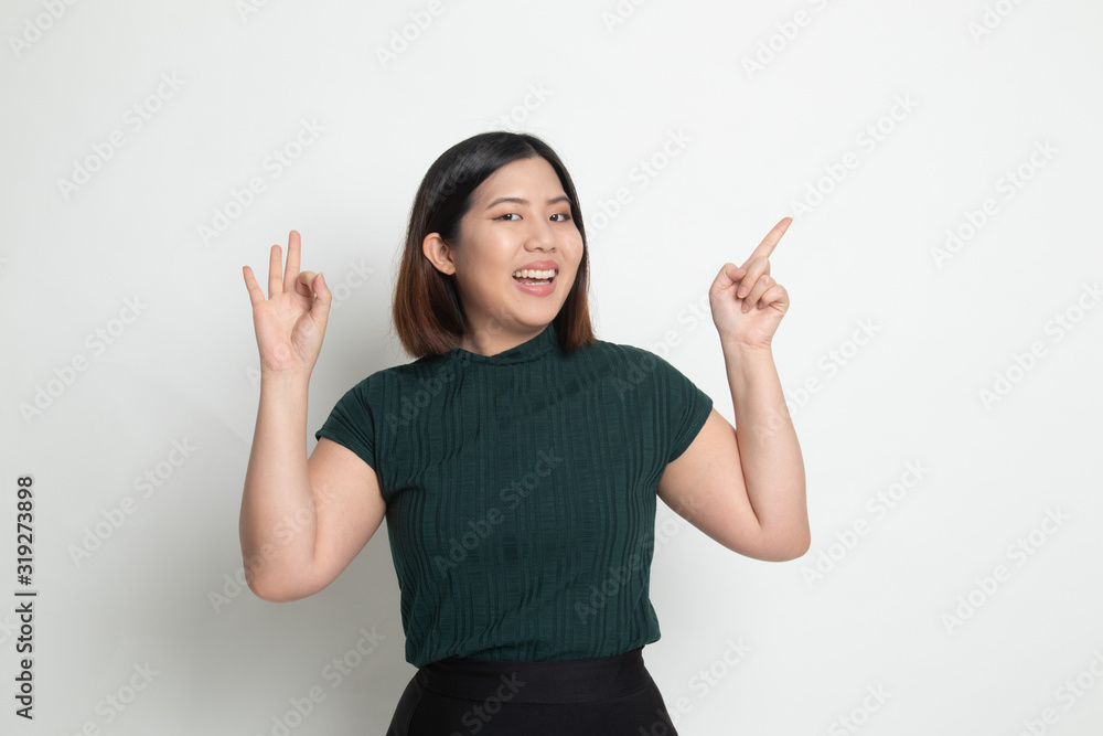 Young Asian woman point and show OK Young Asian woman point and show OK