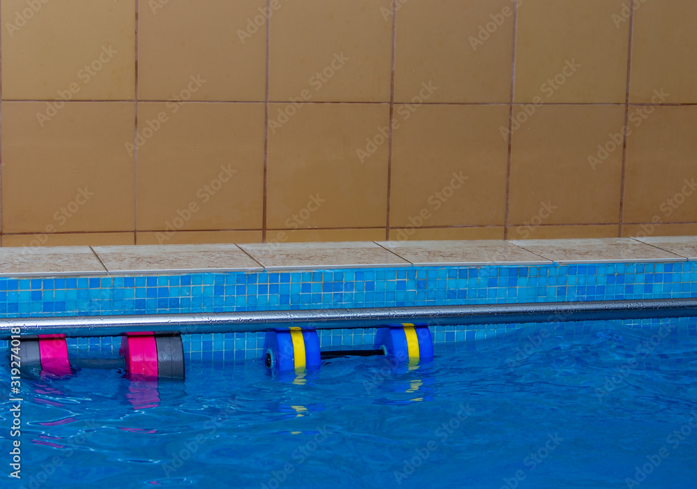 Accessories for swimming training. Dumbbells for swimming. Teaching children to swim..