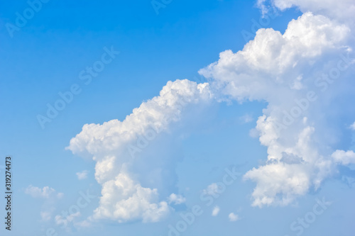 Beautiful white cumulus cloud in the blue sky, close-up