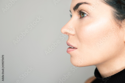 Face profile of a beautiful girl with natural make-up.