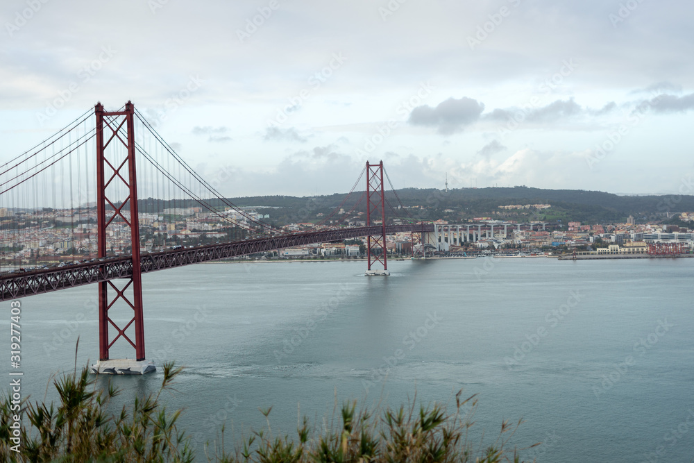 Fototapeta premium 25 de Abril Bridge with Lisbon in the background