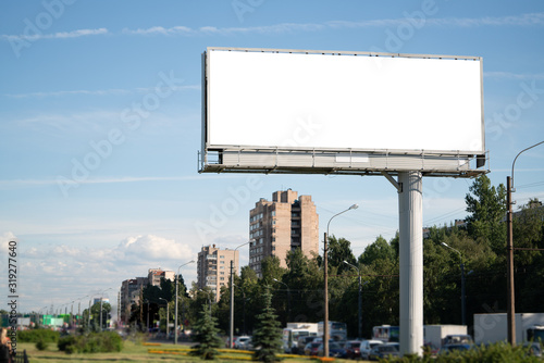 big billboard standing in the city. white advertising field for advertising. Mockup billboard