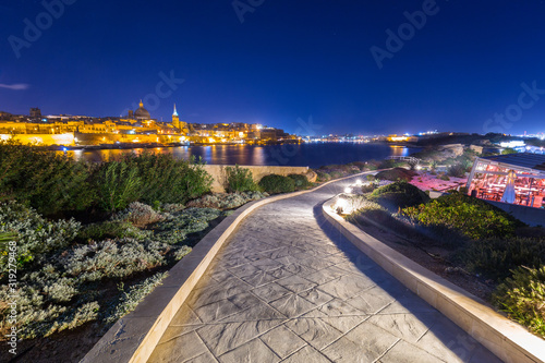 Beautiful sidewalk at the bay in Sliema at night, Malta