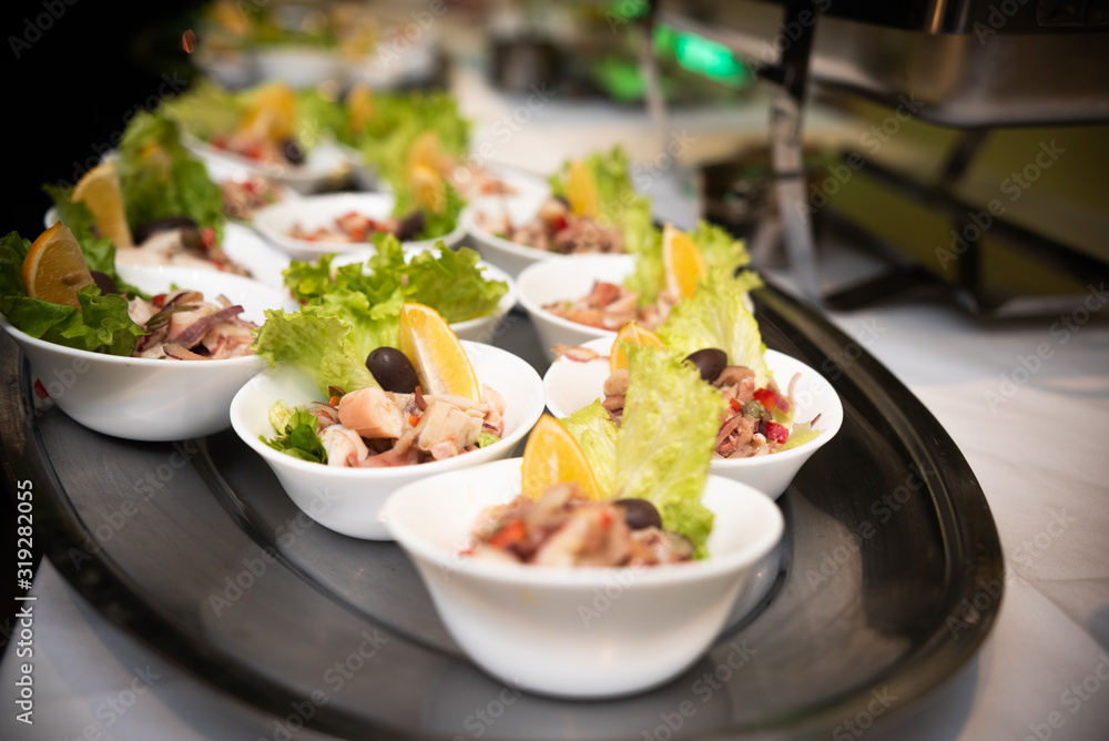 sea salad in small cups on table sea salad in small cups on table