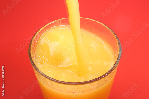 Pouring  a glass of Orange Juice