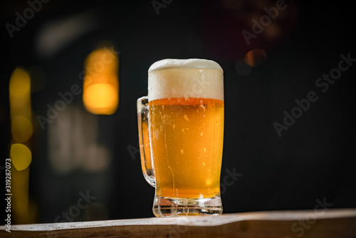 mug full of chopp, with chopp pilsen on a rustic table