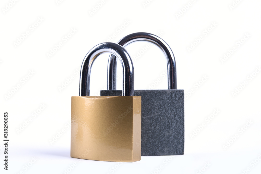 Two Locked grey and golden Padlock on the white background. Two Locked grey and golden Padlock on the white background.