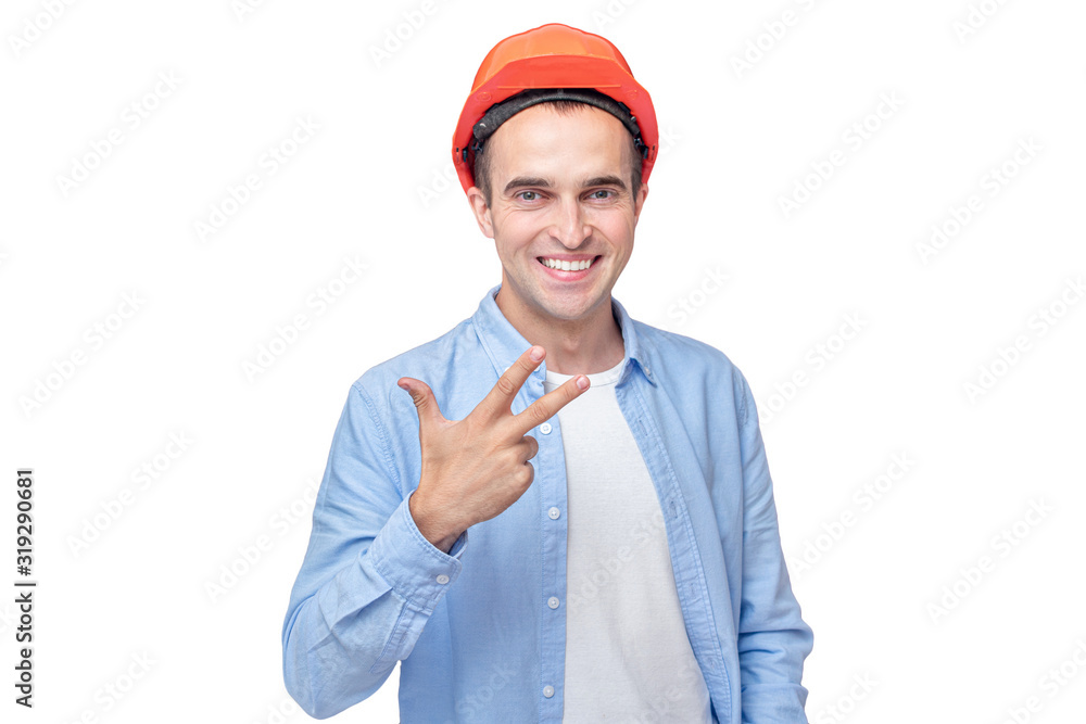 Builder in helmet shows three finger, number three, isolated background, copy space Builder in helmet shows three finger, number three, isolated background, copy space