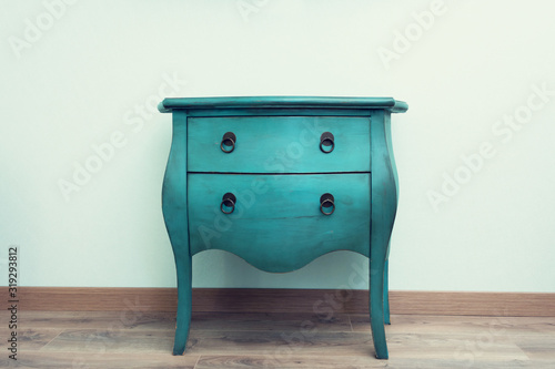 Old blue chest of drawers in the Studio, side view, copy space
