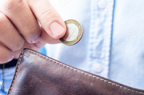 Slika na platnu Man's hands with belarusian coins, closeup, cropped image, poverty concept