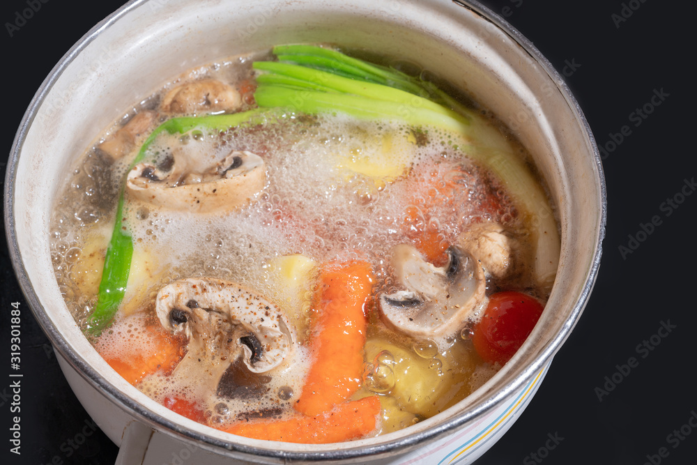 boiling soup with mushrooms and vegetables boiling soup with mushrooms and vegetables