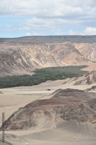 Panoramic views over a river valley in the deserts of Ica, Peru photo